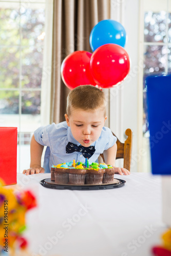 Photo: Boy Blowing Candles On Cake Boy Blowing Candles On Cake