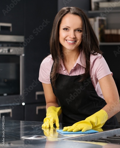 Photo: Young woman on a modern kitchen Young woman on a modern kitchen