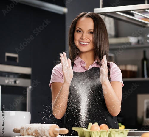 Photo: Young woman on a modern kitchen Young woman on a modern kitchen