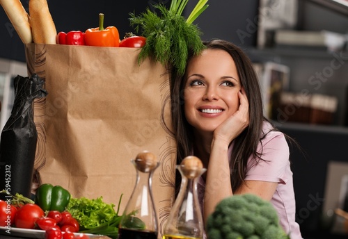 Photo: Young woman on a modern kitchen Young woman on a modern kitchen