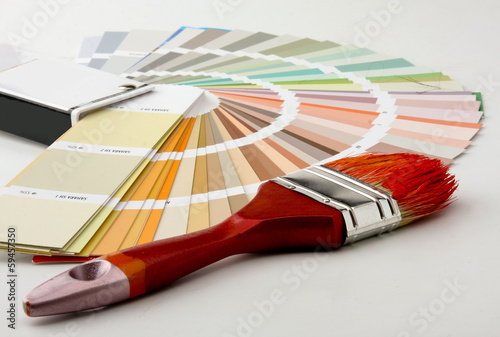 Photo: Close-up of a color palette and a brush on white background Close-up of a color palette and a brush on white background