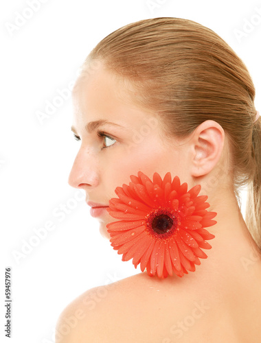 Photo: A beautiful young woman with a flower A beautiful young woman with a flower