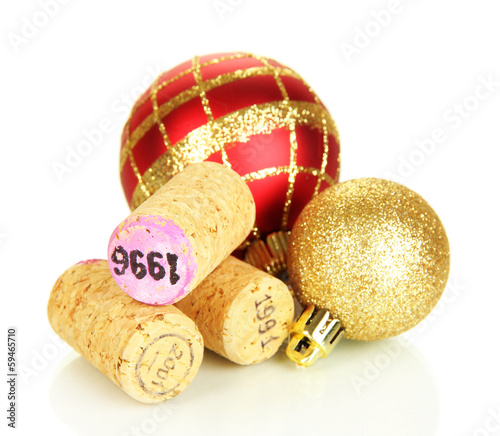 Photo: Wine corks with new Year toys isolated on white Wine corks with new Year toys isolated on white