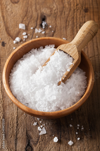Photo: sea salt in wooden bowl and scoop sea salt in wooden bowl and scoop