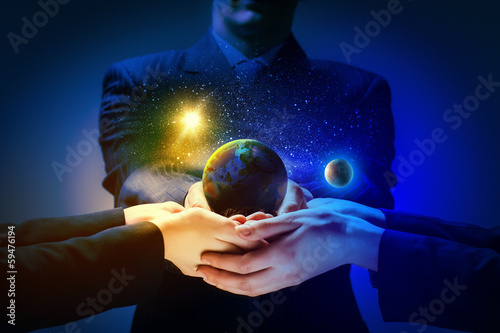 Photo: Earth planet in hands Earth planet in hands