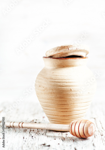 Photo: Clay pot and wooden dipper Clay pot and wooden dipper
