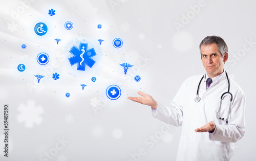 Photo: Doctor with blue medical icons Doctor with blue medical icons