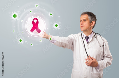 Photo: Middle aged doctor pressing modern medical type of button Middle aged doctor pressing modern medical type of button
