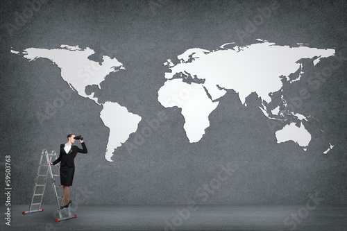 Photo: businesswoman looking through binoculars businesswoman looking through binoculars