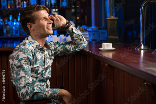 Photo: man talking on the phone man talking on the phone