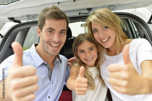 Photo: Cheerful family showing thumbs up Cheerful family showing thumbs up