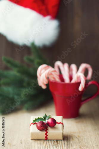 Photo: Christmas gift with candy canes Christmas gift with candy canes