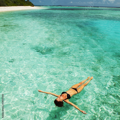 Photo: Woman relaxing in the sea Woman relaxing in the sea