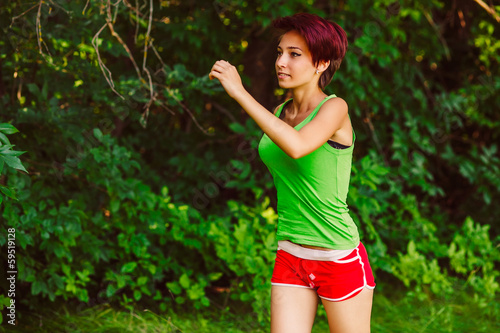 Photo: beautiful healthy runs young brunette woman a athlete running ou beautiful healthy runs young brunette woman a athlete running ou