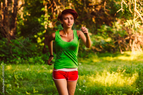 Photo: beautiful healthy runs young brunette woman athlete a running ou beautiful healthy runs young brunette woman athlete a running ou