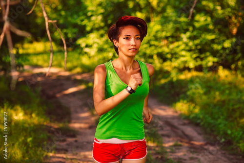 Photo: beautiful healthy runs young brunette woman athlete running a ou beautiful healthy runs young brunette woman athlete running a ou