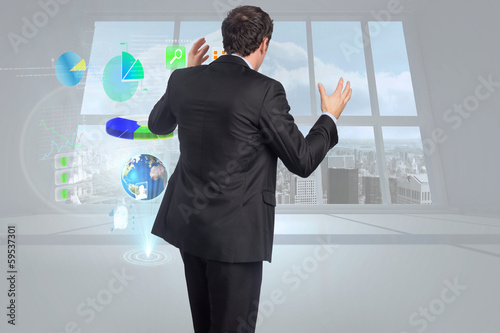 Photo: Composite image of stressed businessman gesturing Composite image of stressed businessman gesturing