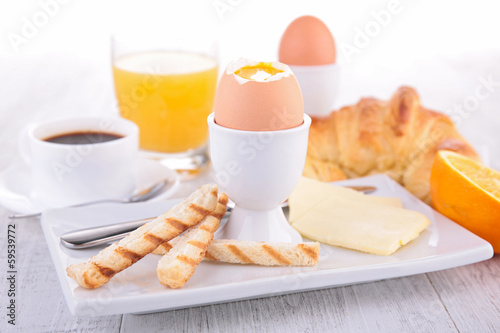 Photo: egg, coffee and croissant egg, coffee and croissant