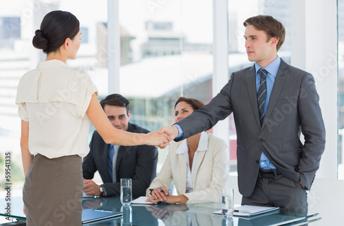 Photo: Handshake to seal a deal after a job recruitment meeting Handshake to seal a deal after a job recruitment meeting