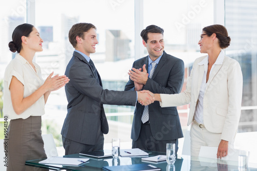 Photo: Handshake to seal a deal after a job recruitment meeting Handshake to seal a deal after a job recruitment meeting