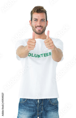 Photo: Portrait of a happy male volunteer gesturing thumbs up Portrait of a happy male volunteer gesturing thumbs up