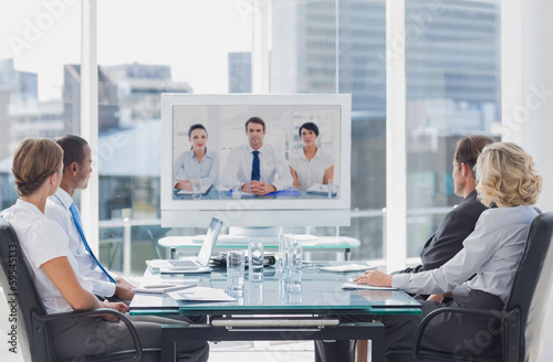 Photo: Business team having video conference Business team having video conference
