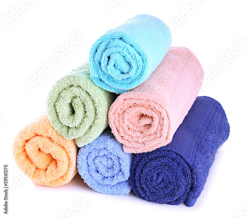 Photo: Colorful towels isolated on white Colorful towels isolated on white