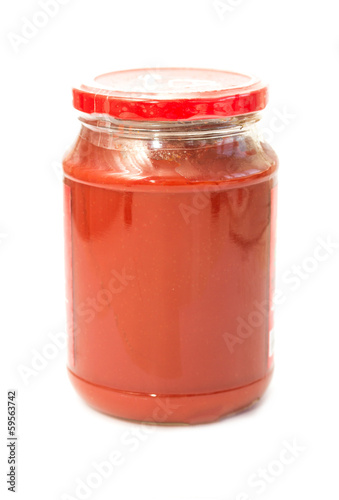 Photo: Jar with tomato paste isolated on white Jar with tomato paste isolated on white
