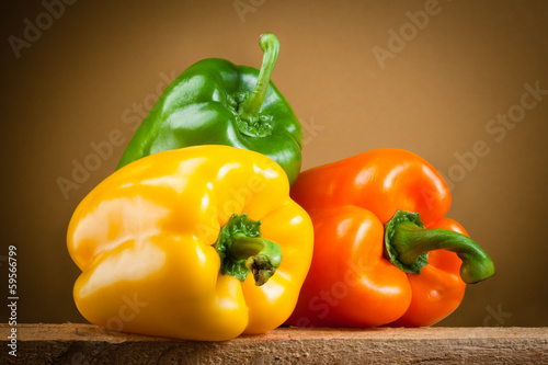 Photo: Organic paprica. Three bell peppers isolated. Clipping path Organic paprica. Three bell peppers isolated. Clipping path
