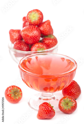 Photo: bowl with strawberries and jelly isolated on white background bowl with strawberries and jelly isolated on white background