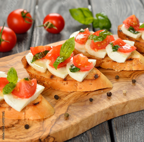 Photo: Bruschetta with mozzarella and tomatoes Bruschetta with mozzarella and tomatoes