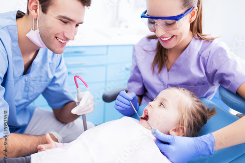 Photo: Girl having teeth examined at dentists Girl having teeth examined at dentists