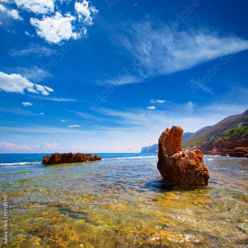 Photo: Denia Alicante Las rotas rocky beach in Spain Denia Alicante Las rotas rocky beach in Spain
