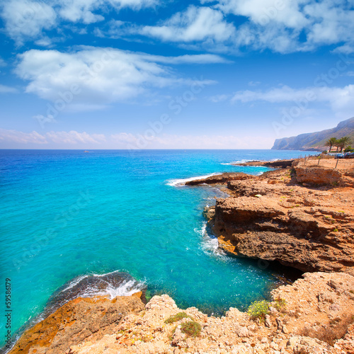 Photo: Denia Alicante Las rotas rocky beach in Spain Denia Alicante Las rotas rocky beach in Spain