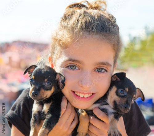 Photo: kid girl playing with puppy dogs smiling kid girl playing with puppy dogs smiling