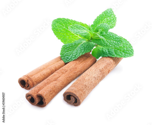 Photo: Cinnamon and mint isolated . Cinnamon and mint isolated .