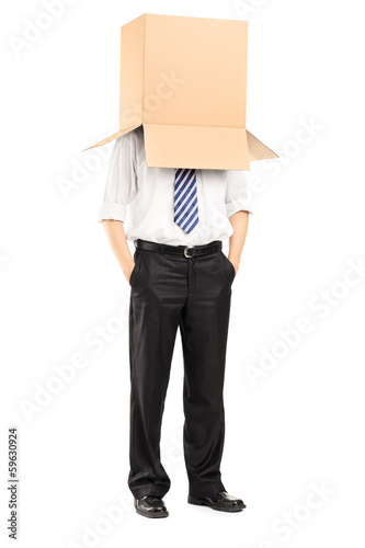 Photo: Full length portrait of a man with a cardboard box on his head Full length portrait of a man with a cardboard box on his head