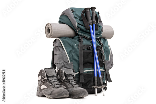 Photo: Hiking equipment, rucksack, boots, poles and slipping pad Hiking equipment, rucksack, boots, poles and slipping pad
