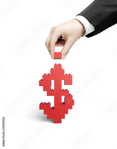 Photo: hand building dollar hand building dollar