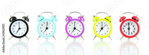 Photo: Colorful alarm clock isolated on white Colorful alarm clock isolated on white