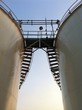 ladder and storage tank ladder and storage tank