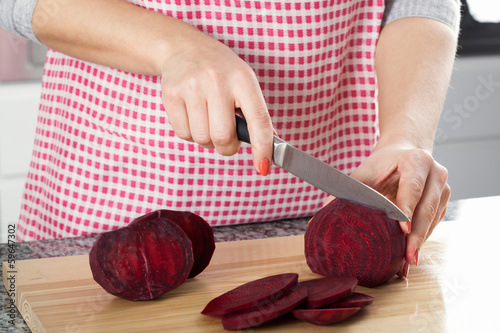 Photo: Housewife cutting beetroot Housewife cutting beetroot