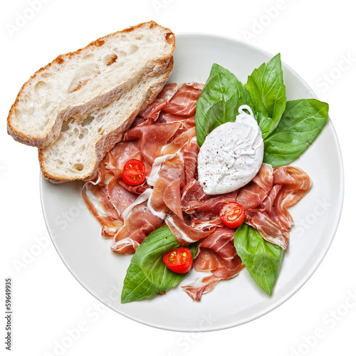 Photo: Ham salad with poached egg on white background Ham salad with poached egg on white background