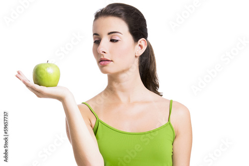 Photo: Healthy woman with a green apple Healthy woman with a green apple