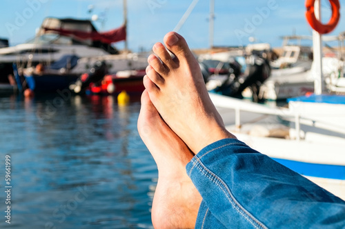 Photo: Male feet against sea Male feet against sea