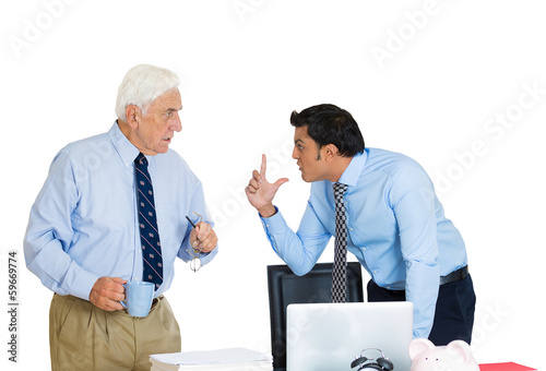 Photo: Conflict at work. Two business men fighting in office Conflict at work. Two business men fighting in office