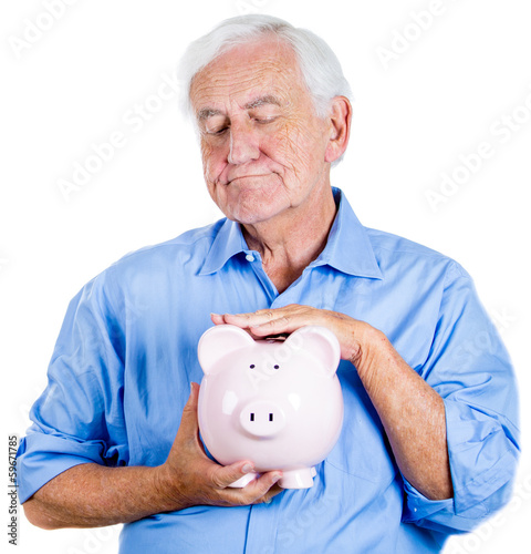 Photo: Old man holding, petting piggy bank. Financial decisions Old man holding, petting piggy bank. Financial decisions