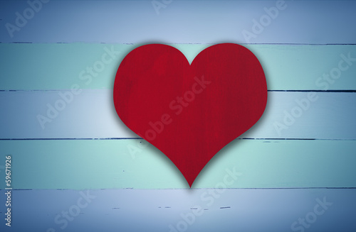 Photo: Red heart sign on blue and green retro wooden panel background Red heart sign on blue and green retro wooden panel background