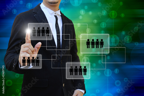 Photo: Businessman touch icon of social network Businessman touch icon of social network