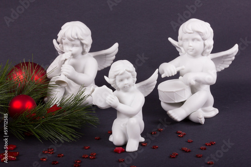 Photo: Weihnachtsengel auf dunklem Hintergrund Weihnachtsengel auf dunklem Hintergrund